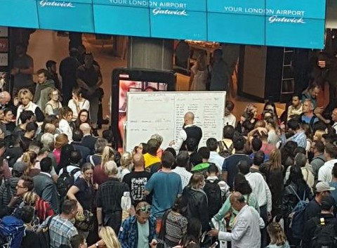 Gatwick Airport staff forced to update flight times on whiteboards after screens go down