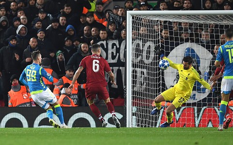 Liverpool reach Champions League knockouts in tense win over Napoli