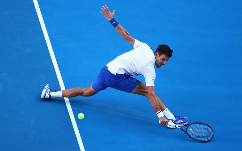 Djokovic advances at Australian Open but shows irritability on and off court