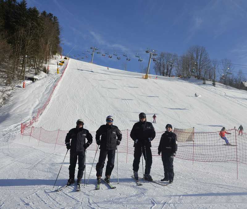 Policemen skiing, on the slopes during the holidays