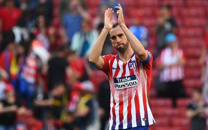 Atletico captain Godin to leave club, lips sealed on next move