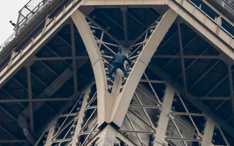 Eiffel Tower evacuated after man climbs on structure