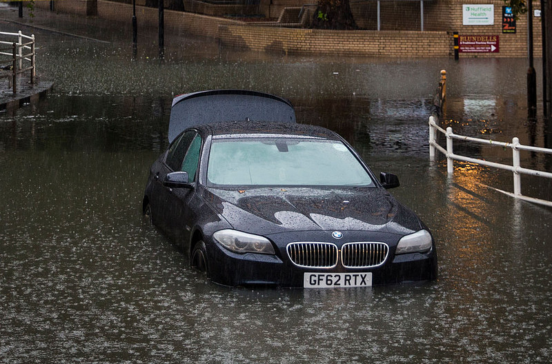 UK weather: Heavy rain causes road and rail chaos
