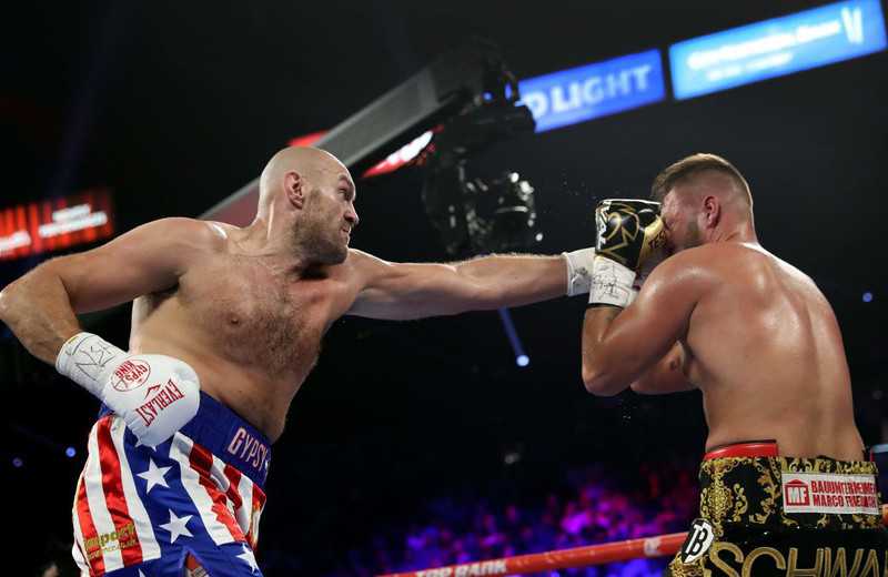 Tyson Fury puts on show with two-round destruction of Tom Schwarz