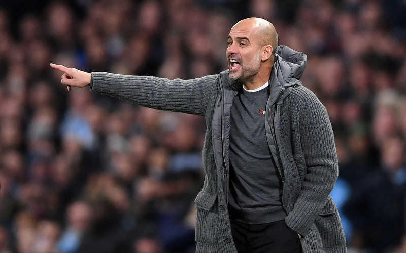 Soccer-Man City boss Guardiola's cardigan raises over 6,000 pounds for charity