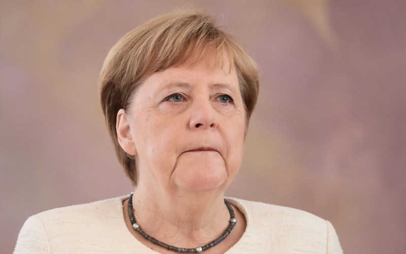 Angela Merkel shakes again during official ceremony