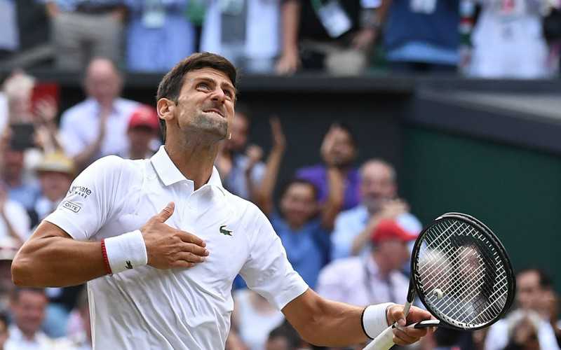 Novak Djokovic downs Roger Federer in record-breaking epic to win fifth Wimbledon