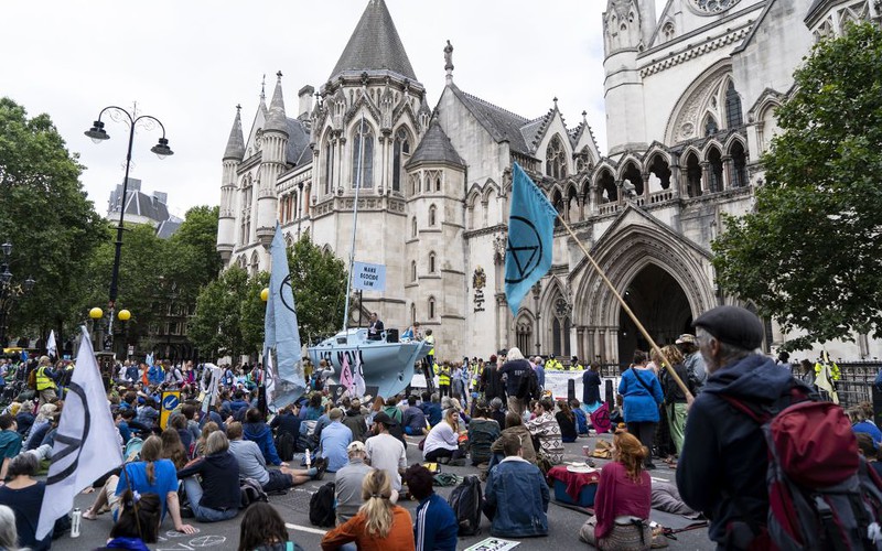 Extinction Rebellion protesters block roads in UK cities