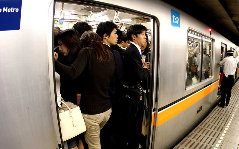Thousands of Tokyo commuters told to work from home to avoid Olympic crush