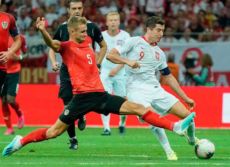 Poland's lead at the top cut after goalless draw with Austria