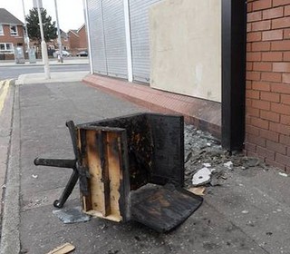 Nail bar owner 'on knees in tears' outside destroyed Belfast business after racially motivated arson