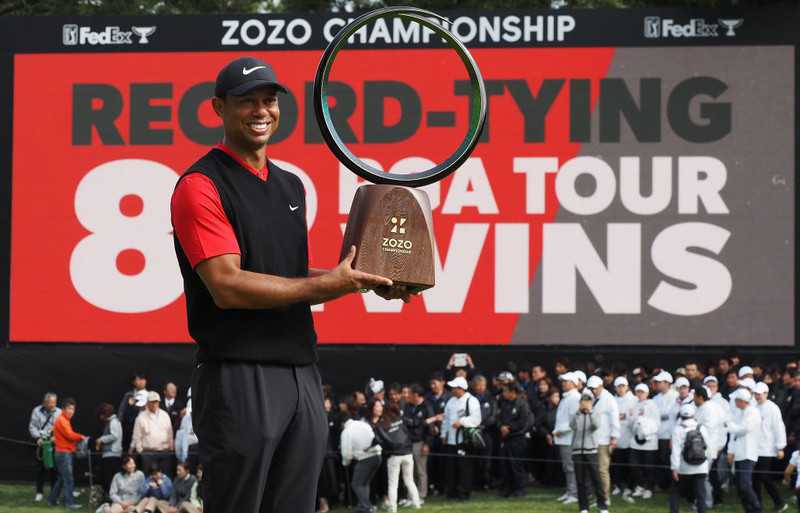 Tiger Woods ties record for most PGA Tour titles with 82nd win in Japan