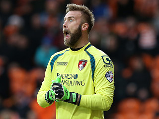 Artur Boruc celebrates with Bournemouth fans after historic win