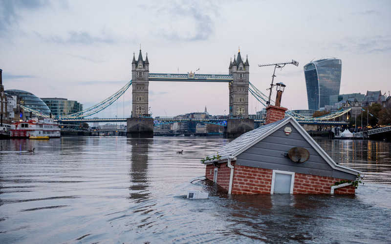 Extinction Rebellion activists float 'sinking house' along the River Thames