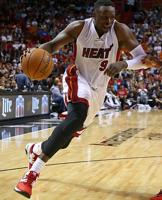 Luol Deng opts in to stay next season with Miami Heat