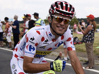 Henri Lemoine is a father of t shirt with polka dot jersey, a white jersey with red dots.