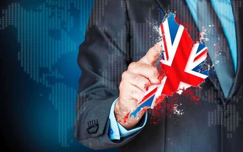 Fitch lowers UK rating and outlook is negative
