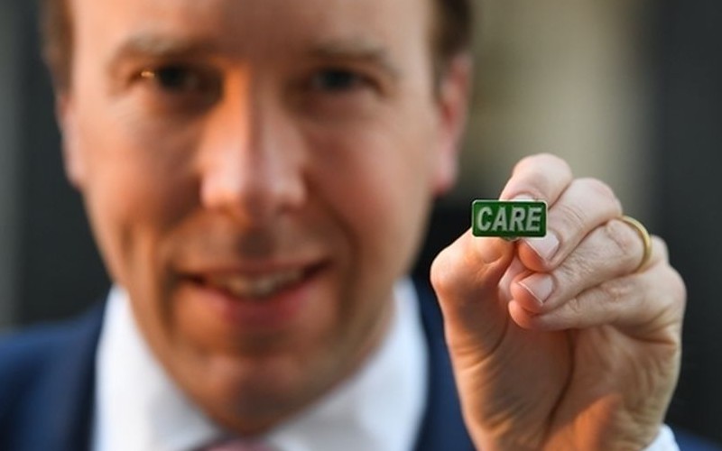 Government faces backlash for carers' 'badge of honour' scheme