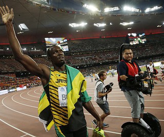 Usain Bolt accepts bracelet apology from the Segway TV cameraman at World Championships in Beijing