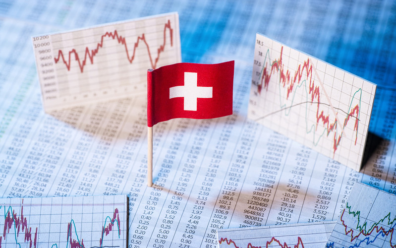 Swiss flag financial risk with economy in deepest dive since 70s