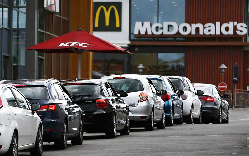McDonald's slashes prices and trials dine-in