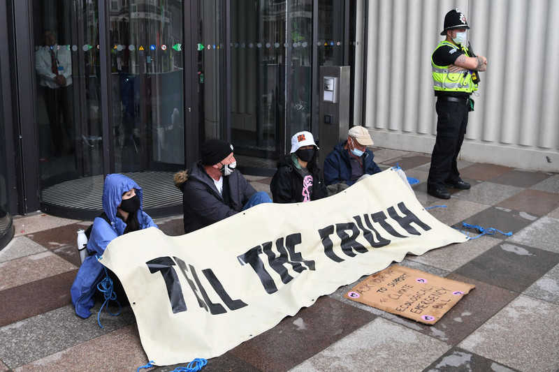 Climate activists from Extinction Rebellion stuck to parliament