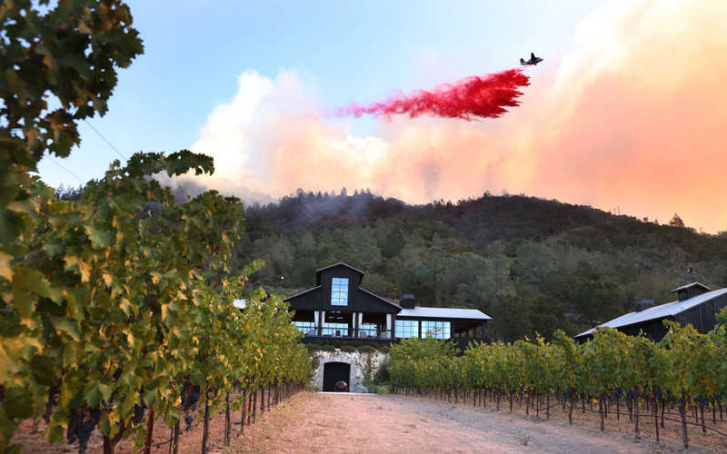 Wine country under siege from destructive fires as residents flee, structures burn