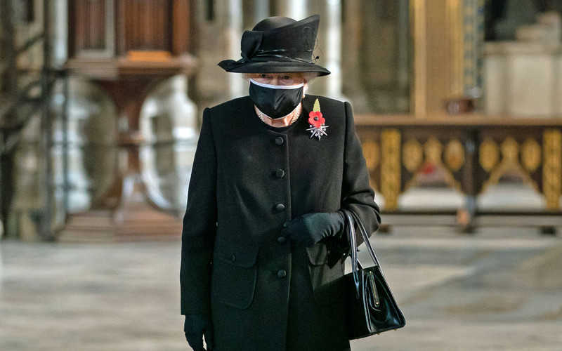 Britain's Queen Elizabeth seen in face mask for first time during public ceremony