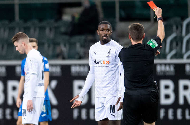 Marcus Thuram: Borussia Monchengladbach forward apologises for spitting at face of opponent