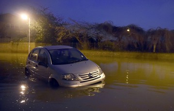 London underwater: Cars lie abandoned in upmarket areas of the capital as floods continue