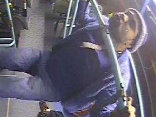 Thug caught doing chin-ups on bus moments after punching woman