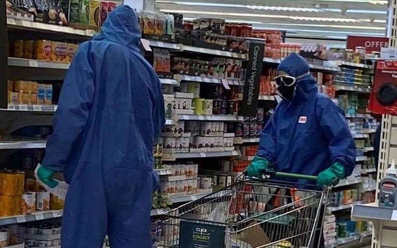 Couple spotted at Waitrose in full hazmat suits, rubber gloves and goggles