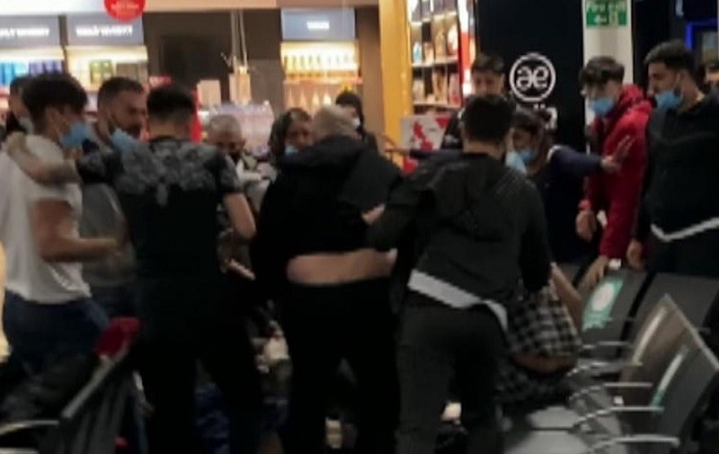 Mass brawl between Luton Airport passengers leaves three seriously injured and 17 arrested