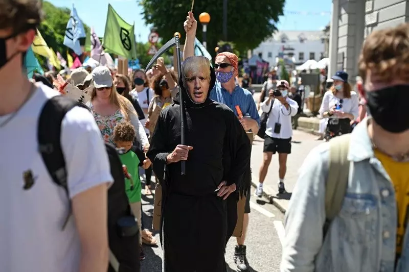 G7 in Cornwall: Hundreds on streets and in sea for protests