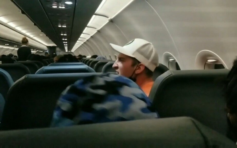 Passenger arrives taped to a seat and is charged with assaulting flight attendan