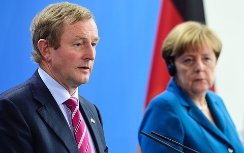 Kenny, Merkel want Britain's May to quickly define EU ties