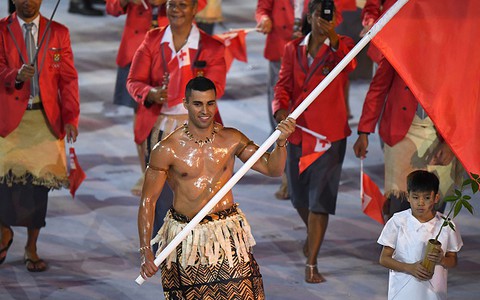 Tonga's oiled flag-bearer a social media sensation