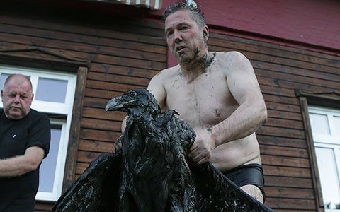 Polish man crawls through mud to save a white-tailed eagle