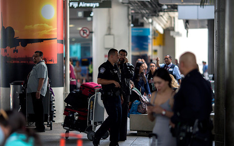 No shooter found at LA airport after passengers flee terminal.