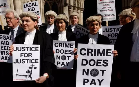 Criminal barristers in England and Wales vote to go on all-out strike