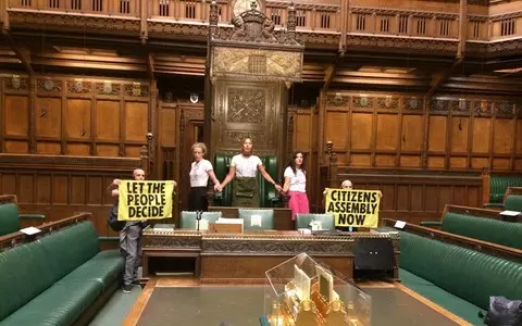 Climate activists stuck to the floor of the House of Commons meeting room