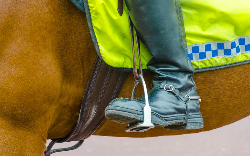 UK mounted police chase down man holding mobile phone while driving