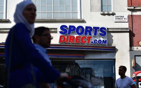 Sports Direct chairman lambasts critics as profits fall