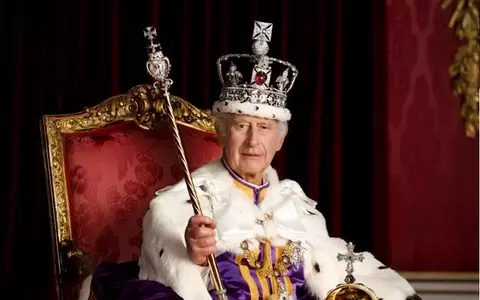 King Charles and Queen Camilla pose in royal regalia for official portraits