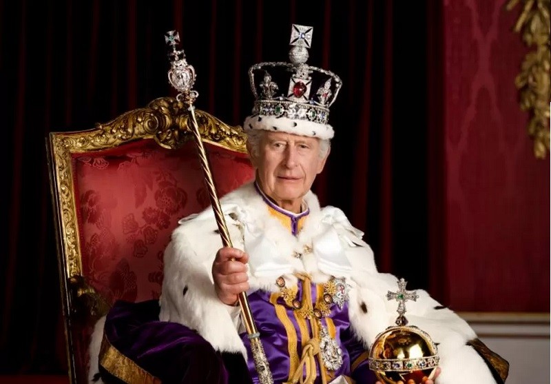 King Charles and Queen Camilla pose in royal regalia for official portraits