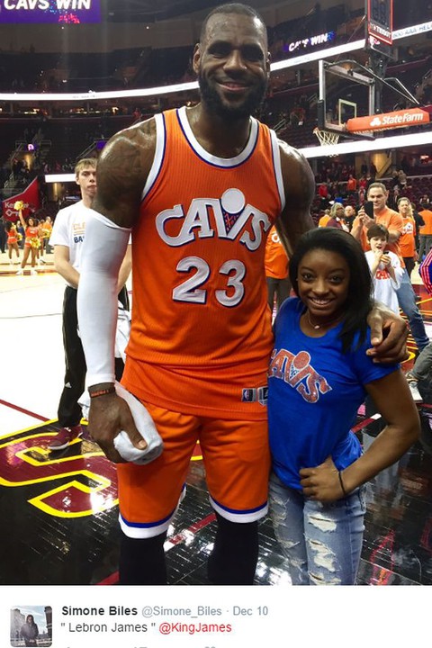 The pair of gold medal-winning athletes posed for a snap or two together at the game