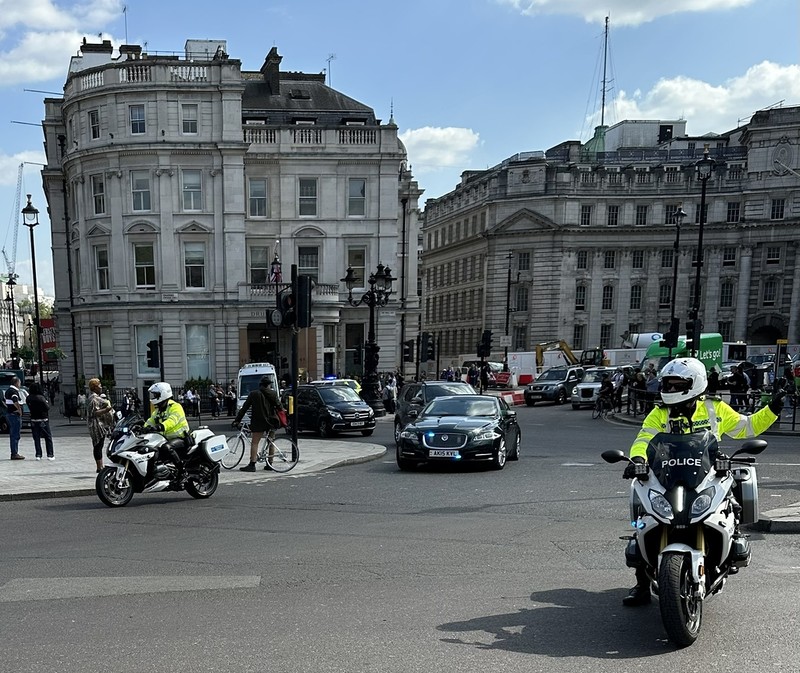 An 81-year-old British woman has died after being hit by a motorcycle of the royal escort