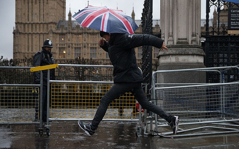 Travel chaos grips Britain as snow, rain and hurricane-force winds hit