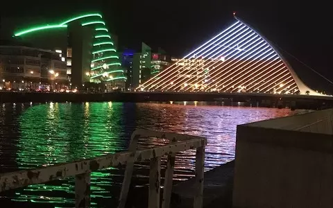 The most characteristic bridge in Dublin illuminated in white and red