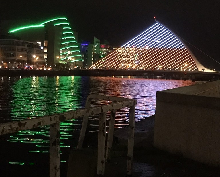 The most characteristic bridge in Dublin illuminated in white and red